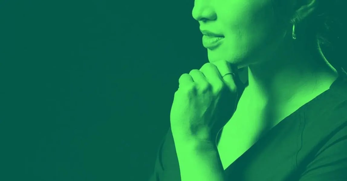 A woman thinking about getting buy-in for DEI